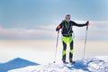 Mountaineer skier arriving at the summit