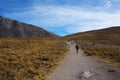 Mountaineer walking towards the mountain