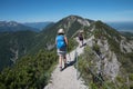 mountaineering young women from the back, on mountain ridge herzogstand