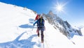 Mountaineers climb a snowy peak. In background the famous peak Dent du Geant in the Mont Blanc Massif, the highest european mounta Royalty Free Stock Photo