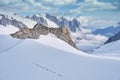 Mountaineers roped together to ascend a glacier