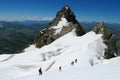 Mountaineers on snow and rocks Royalty Free Stock Photo