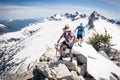 Mountaineers on a snowy mountain ridge.