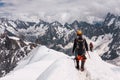 Mountaineers on the top of a snowy mountain in the Alps