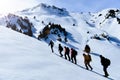 Mountaineers who walk towards snowy mountains