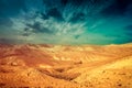 Mountainous desert with colorful cloudy sky