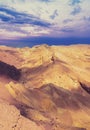 Mountainous desert with colorful cloudy sky. Sunset in desert Royalty Free Stock Photo