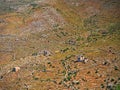 Mountainous field with old walls and towers buildings remains in Mani, Peloponnese, Greece