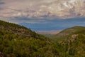 View from the Sandia Man Cave looking towards Placitas, outside of Albuquerque, New Mexico showing the green forest in the Sandia