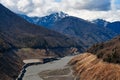 A mountainous landscape with a large dewatered mountain river Royalty Free Stock Photo