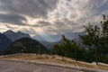 Mountainous landscape with overcast sky and sunbeam