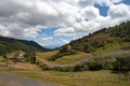 Mountainous landscape with partly cloudy sky