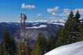 Winter mountain landscape and relay antennas - Ciucas Mountains, landmark attraction in Romania Royalty Free Stock Photo