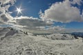 Winter mountain landscape. Sun and snow at high altitude - Ciucas Mountains, landmark attraction in Romania Royalty Free Stock Photo