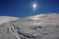 Winter mountain landscape. Sun, snow and ice at high altitude - Ciucas Mountains, landmark attraction in Romania Royalty Free Stock Photo