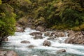 Mountainous Monkey creek flowing through impressive landscape next to Milford Sound highway, New Zealand Royalty Free Stock Photo