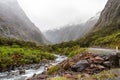 Mountainous Monkey creek flowing through impressive landscape next to Milford Sound highway, New Zealand Royalty Free Stock Photo