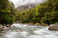 Mountainous Monkey creek flowing through impressive landscape next to Milford Sound highway, New Zealand Royalty Free Stock Photo