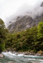 Mountainous Monkey creek flowing through impressive landscape next to Milford Sound highway, New Zealand Royalty Free Stock Photo