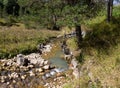 Shallow riverbed with a rocky bottom , unhurried flow of water, autumn walks in nature