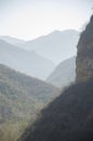 Mountains foggy white blue sky. Chinese autumn mountains.