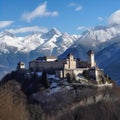 Mountains Alps, massive slopes, snow-capped peaks, ancient castle, high towers with sharp spiers