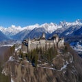 Mountains Alps, massive slopes, snow-capped peaks, ancient castle, high towers with sharp spiers