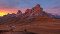 Mountains in the Alps at sunset. View of the alpine valley. Winding road. Mount Passo Giau in the Italian Dolomites