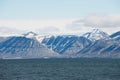 Mountains at the arctic shore of the polar archipelago of Spitsbergen near Longyearbyen, Norway. Royalty Free Stock Photo