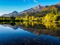 Mountains in autumn colors reflecting the lake Royalty Free Stock Photo