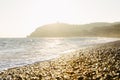 Mountains, the Black Sea and a beach with pebbles. Sunset. Natural background Royalty Free Stock Photo