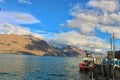 Mountains and a boat at lake Wakatipu in Queenstown, New Zealand