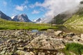 Mountains clean lake among stones