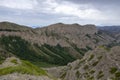 Mountains cliff with erroded soil. Wild outdoor landscape. Adventure tourism. Royalty Free Stock Photo