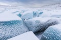 Mountains with clouds on Antarctica. Glaciers, icebergs and ice caves of Southern hemisphere. Global climate change on Earth.