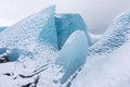 Mountains with clouds on Antarctica. Glaciers, icebergs and ice caves of Southern hemisphere. Global climate change on Earth.