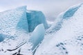 Mountains with clouds on Antarctica. Glaciers, icebergs and ice caves of Southern hemisphere. Global climate change on Earth.