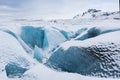 Mountains with clouds on Antarctica. Glaciers, icebergs and ice caves of Southern hemisphere. Global climate change on Earth.