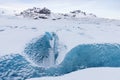 Mountains with clouds on Antarctica. Glaciers, icebergs and ice caves of Southern hemisphere. Global climate change on Earth.