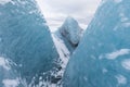 Mountains with clouds on Antarctica. Glaciers, icebergs and ice caves of Southern hemisphere. Global climate change on Earth.