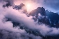 Mountains in clouds in overcast colorful evening