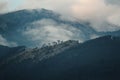 Mountains in clouds at sunset Royalty Free Stock Photo