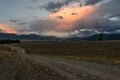 Mountains clouds sunset pink road Royalty Free Stock Photo