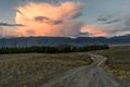 Mountains clouds sunset pink road Royalty Free Stock Photo