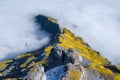 Mountains and clouds in the valley. Natural landscape high in the mountains. Cableway in the mountains. Transportation.