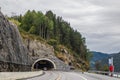 Mountains cloudy road to tunnel travel Norway