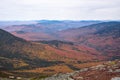 Mountains covered with deciduous forest at the peak of fall foliage Royalty Free Stock Photo