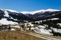 Mountains covered in snow on sunny day. Early spring landscape Royalty Free Stock Photo