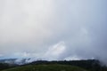 Mountains, fields and forest in cloudy weather. Nature and landscape of national Park in Caucasus. Dense coniferous green summer Royalty Free Stock Photo