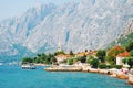 Mountains and fishing boats near town Perast, Kotor bay Royalty Free Stock Photo